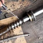 Broken return spring of single acting cylinder caused by spring fatigue