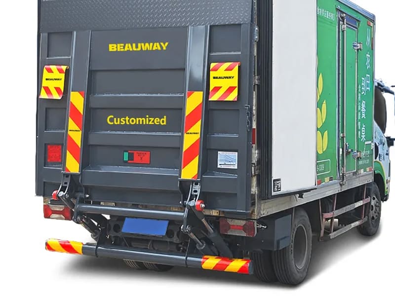 Truck tail lift with single acting hydraulic cylinders