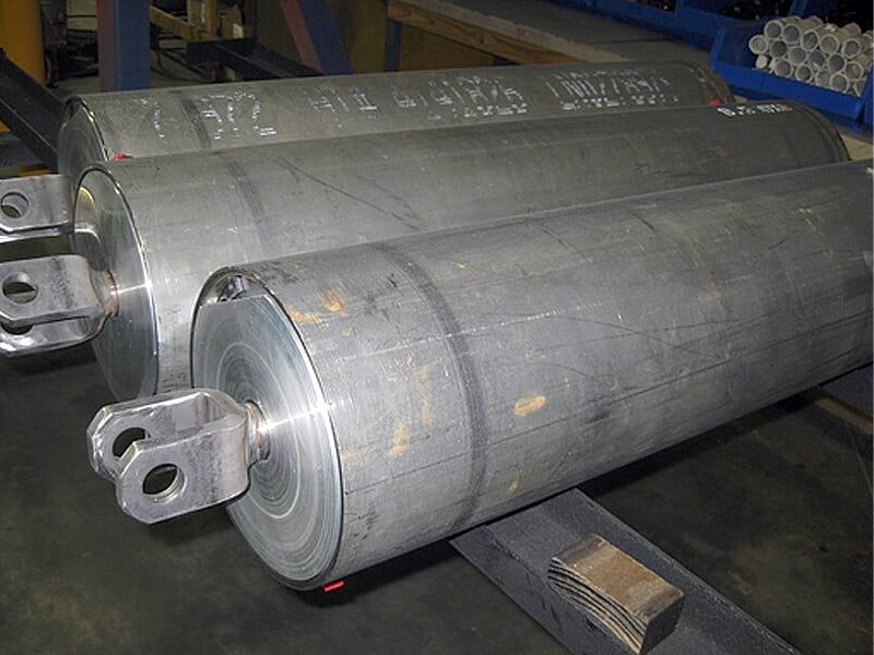 Heavy forged raw hydraulic cylinder tubes with rod eyes in manufacturing workshop