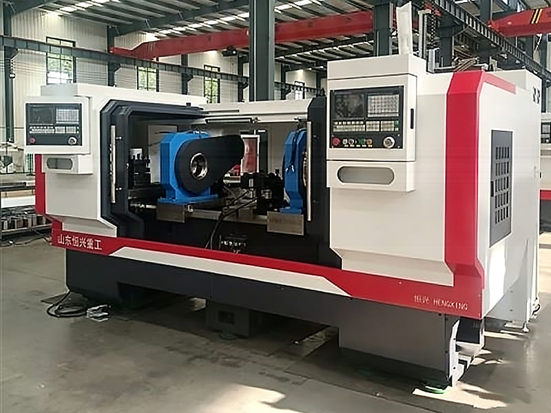 Dual spindle CNC lathe machine tool inside heavy‑industry workshop