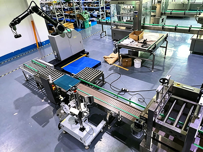 Modern automated workshop with robotic arm, conveyor and packaging machinery
