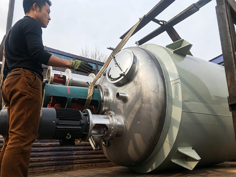 Stainless steel jacketed chemical reactor with stirring motor ready for shipment
