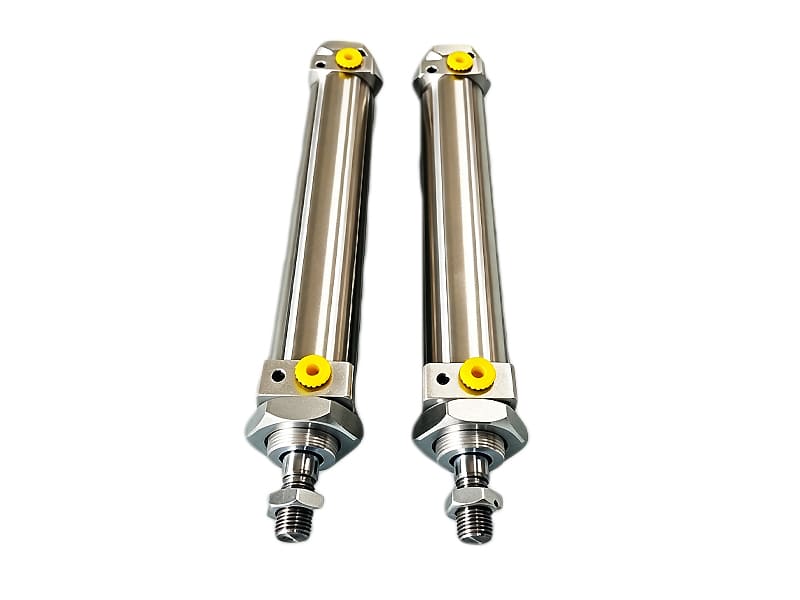 Two stainless steel mini pneumatic hydraulic cylinders side by side