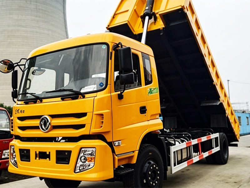 Yellow dump truck equipped with hydraulic lifting cylinder for construction site