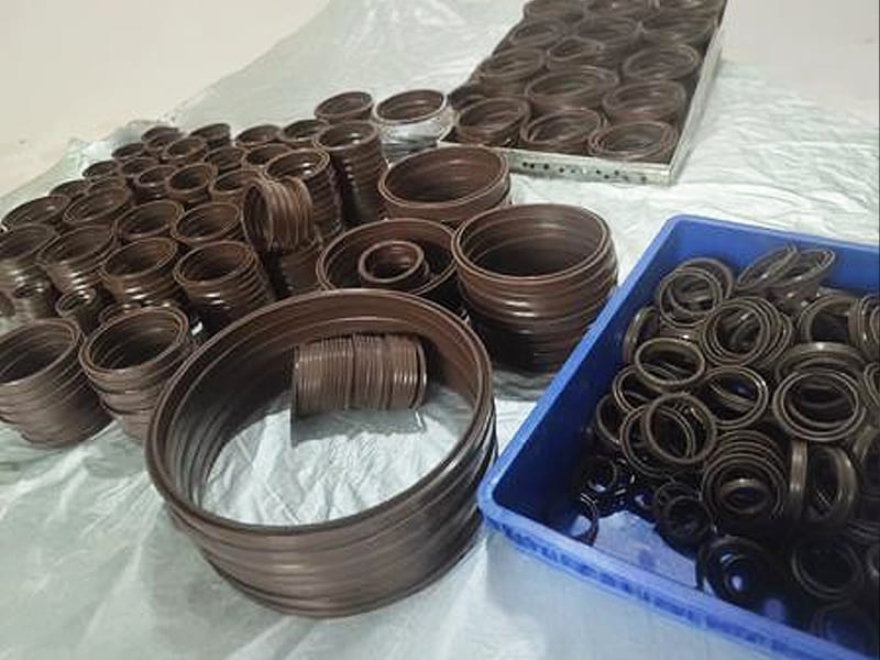 Various sizes of hydraulic oil seals and backup rings stored as maintenance spare parts