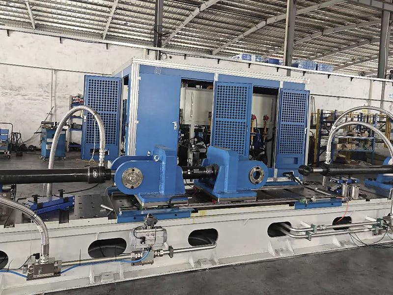 Large‑scale hydraulic cylinder test station in factory workshop for pressure and fatigue testing