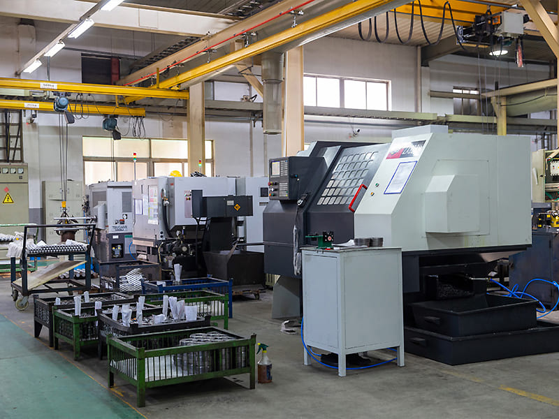 CNC lathe equipment in factory workshop for turning hydraulic cylinder metal parts