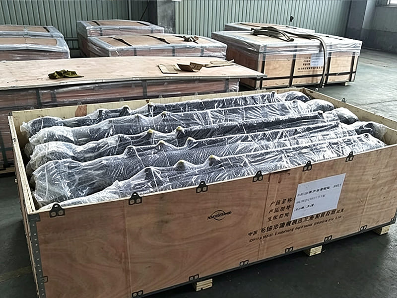 Large quantity hydraulic cylinders wrapped plastic film inside plywood export crate