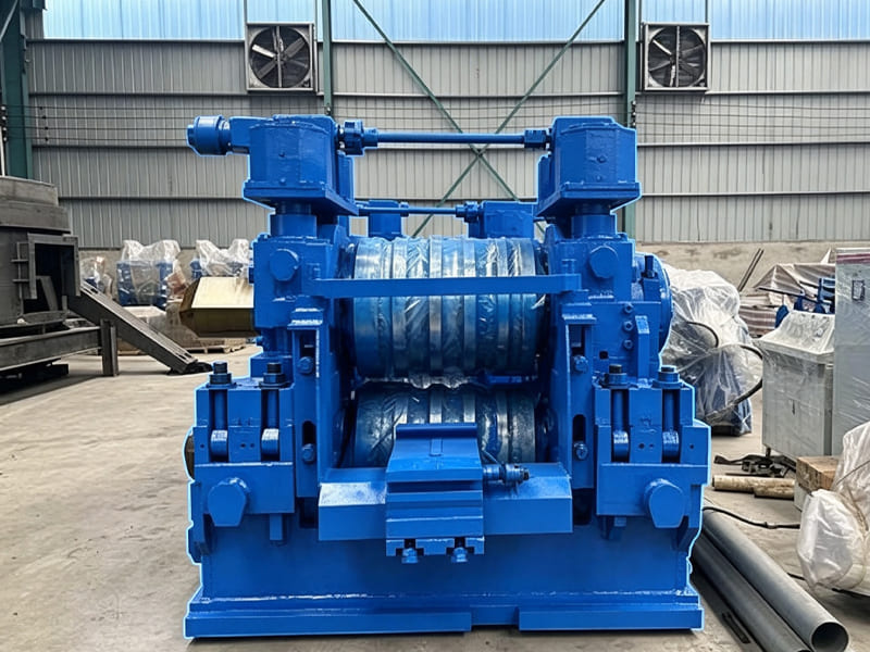 Heavy blue rolling mill machine placed inside factory workshop for metal rolling processing