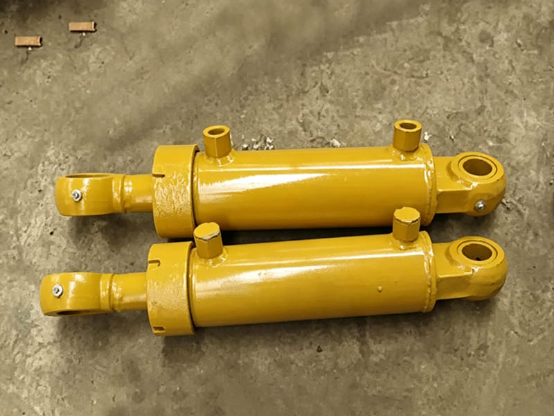 Orange welded hydraulic cylinder with spherical plain bearings for construction equipment