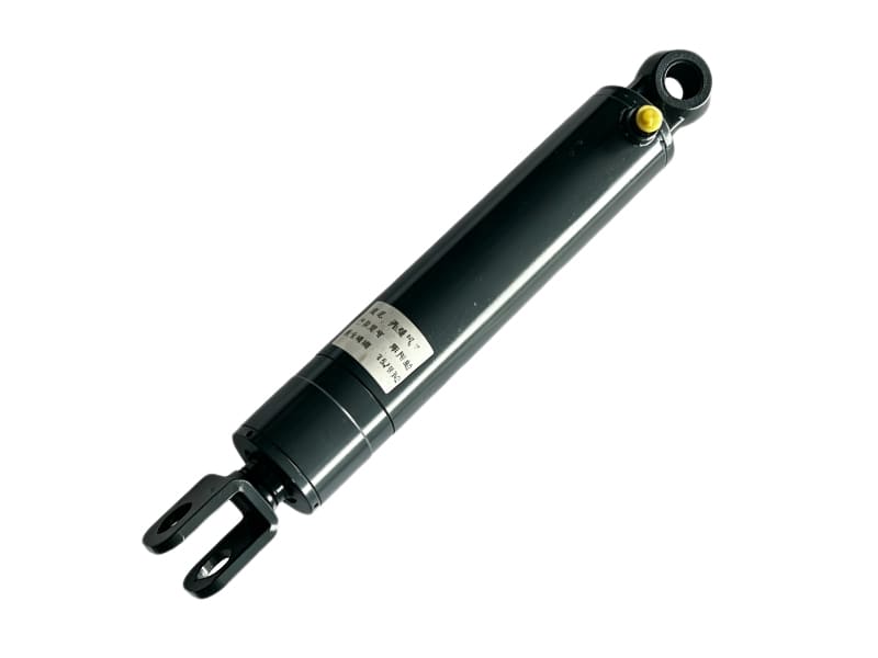 Black hydraulic cylinder with clevis mounting end and nameplate