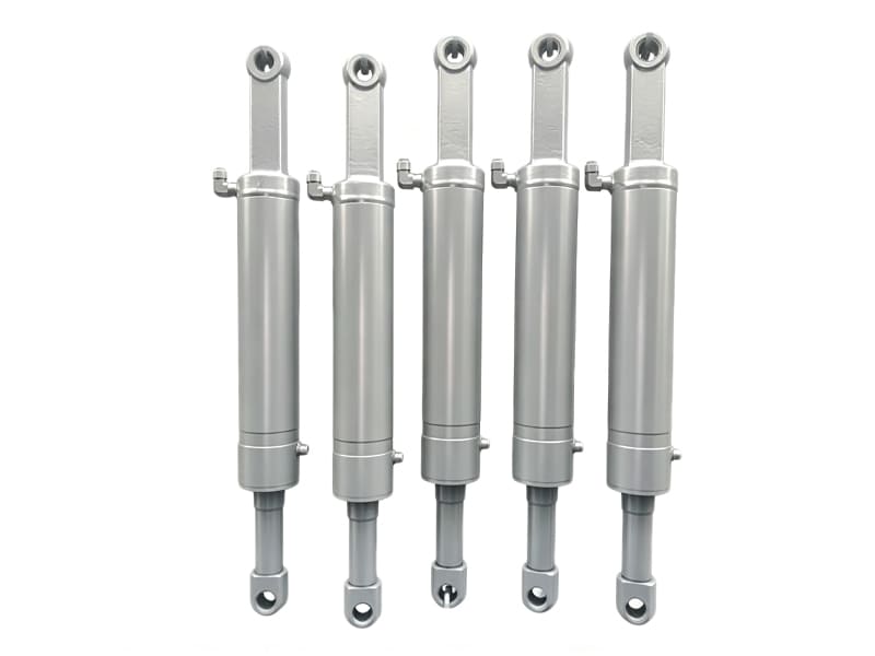 Two heavy-duty grey hydraulic cylinders for construction equipment