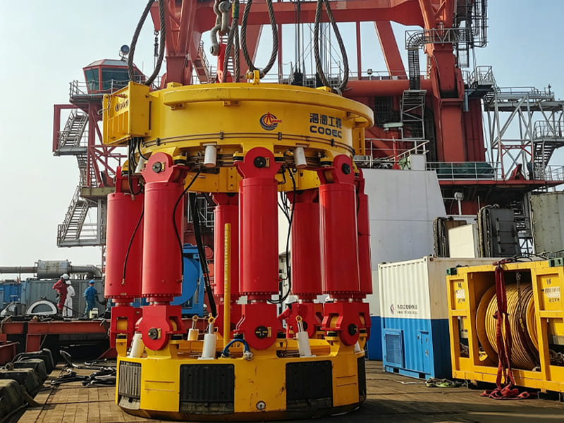 Large marine hydraulic lifting unit with multiple red hydraulic cylinders