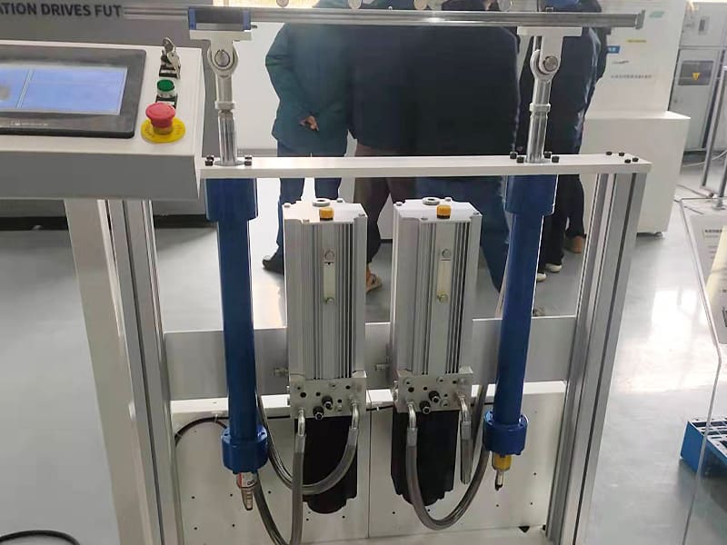 Lab hydraulic cylinder test rig with two hydraulic cylinders and servo motors, control touchscreen on test bench