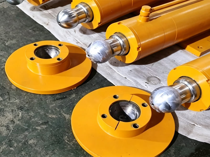 Yellow single acting hydraulic cylinder with eye mount for wheel loader