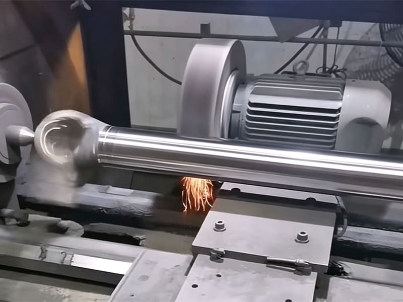 Machined metal piston part with multi-ring sealing grooves and external thread for hydraulic cylinder assembly.